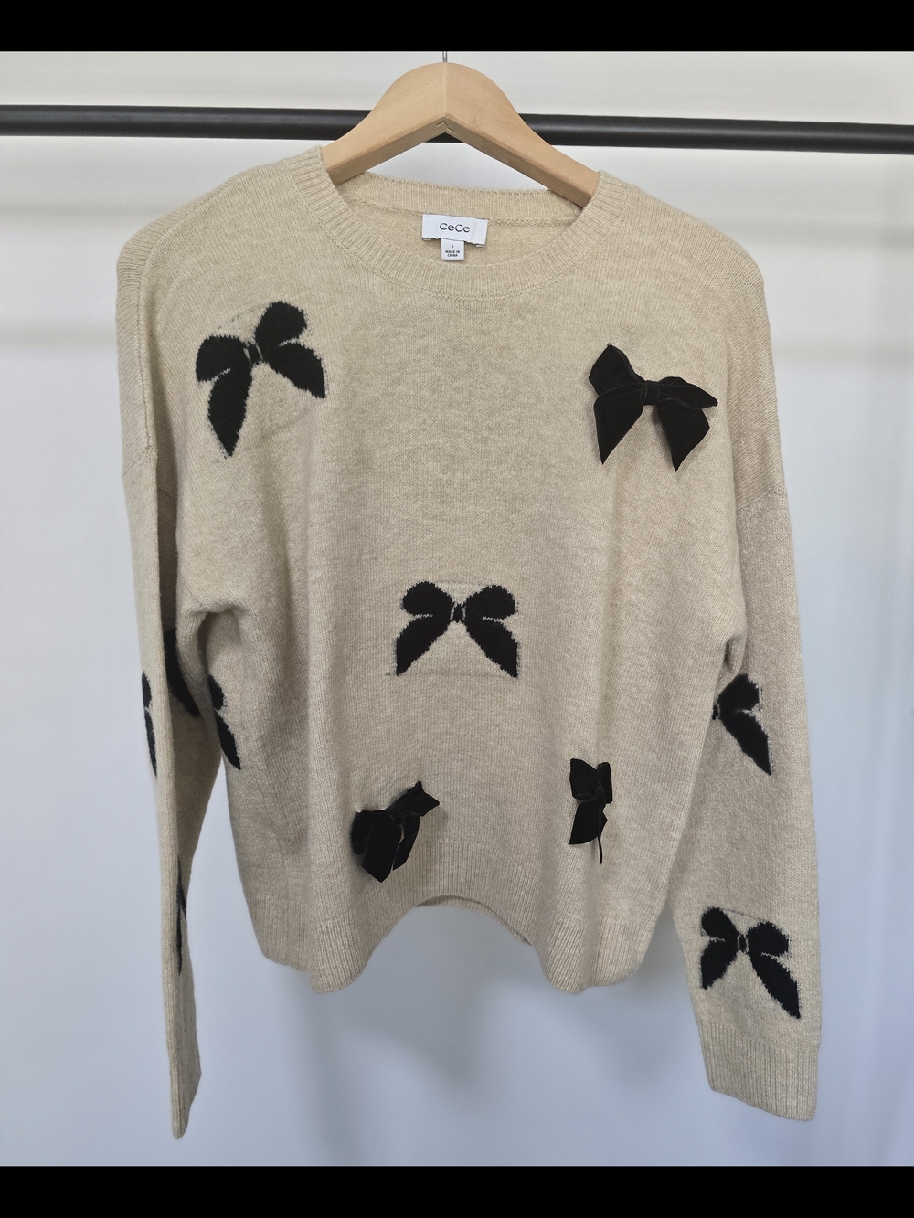 CeCe Beige Crewneck Sweater with Black Bow Accents